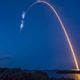 A bright white trail is in view after the SpaceX Falcon 9 rocket carrying the Dragon capsule lifts off from Launch Complex 39A at NASA’s Kennedy Space Center in Florida on July 14, 2022, on the company’s 25th Commercial Resupply Services mission for the agency to the International Space Station